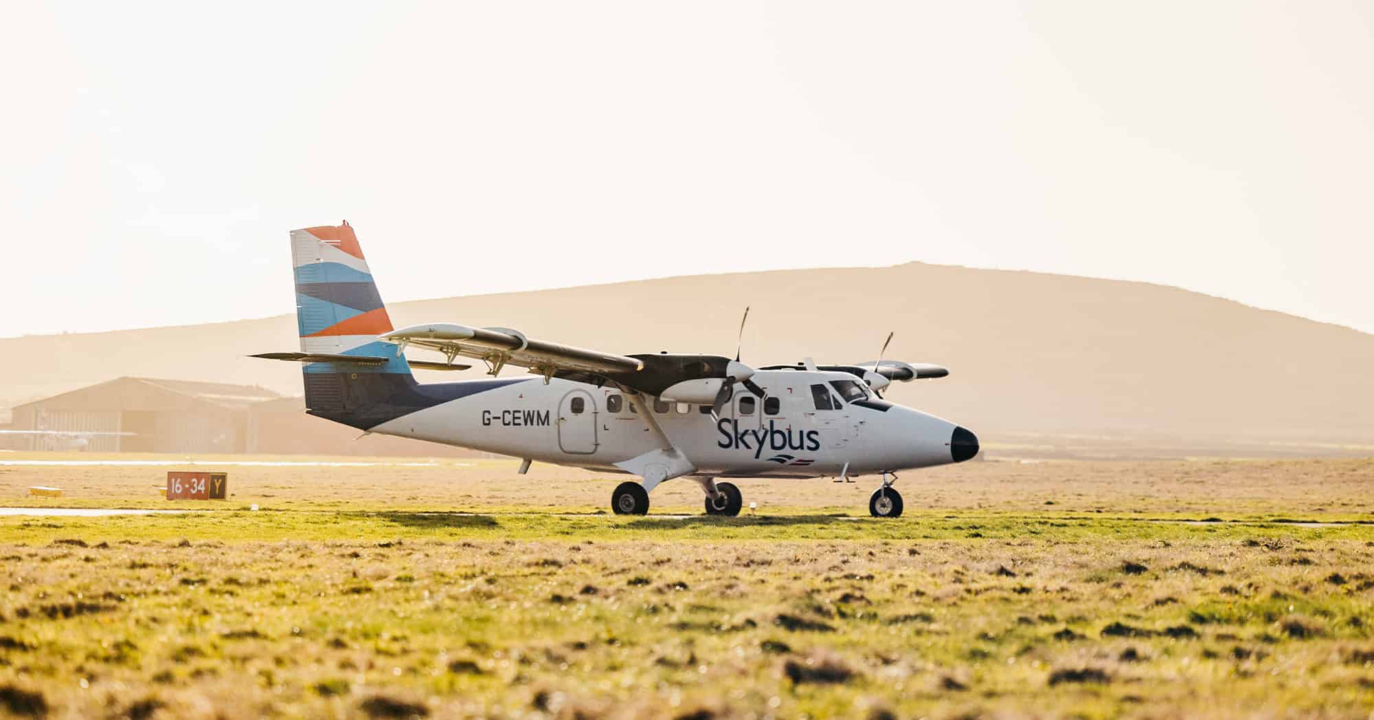 Skybus Twin otter on the runway at Land's End Airport in the morning - Isles of Scilly Travel