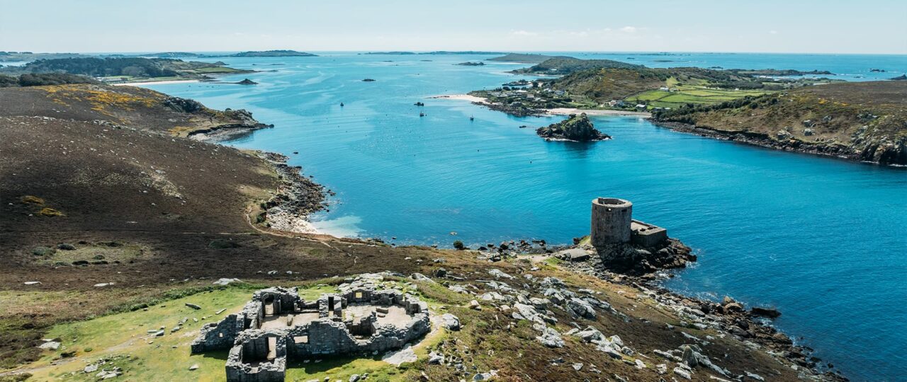view of the 2 castles on tresco, down the channel towards bryher