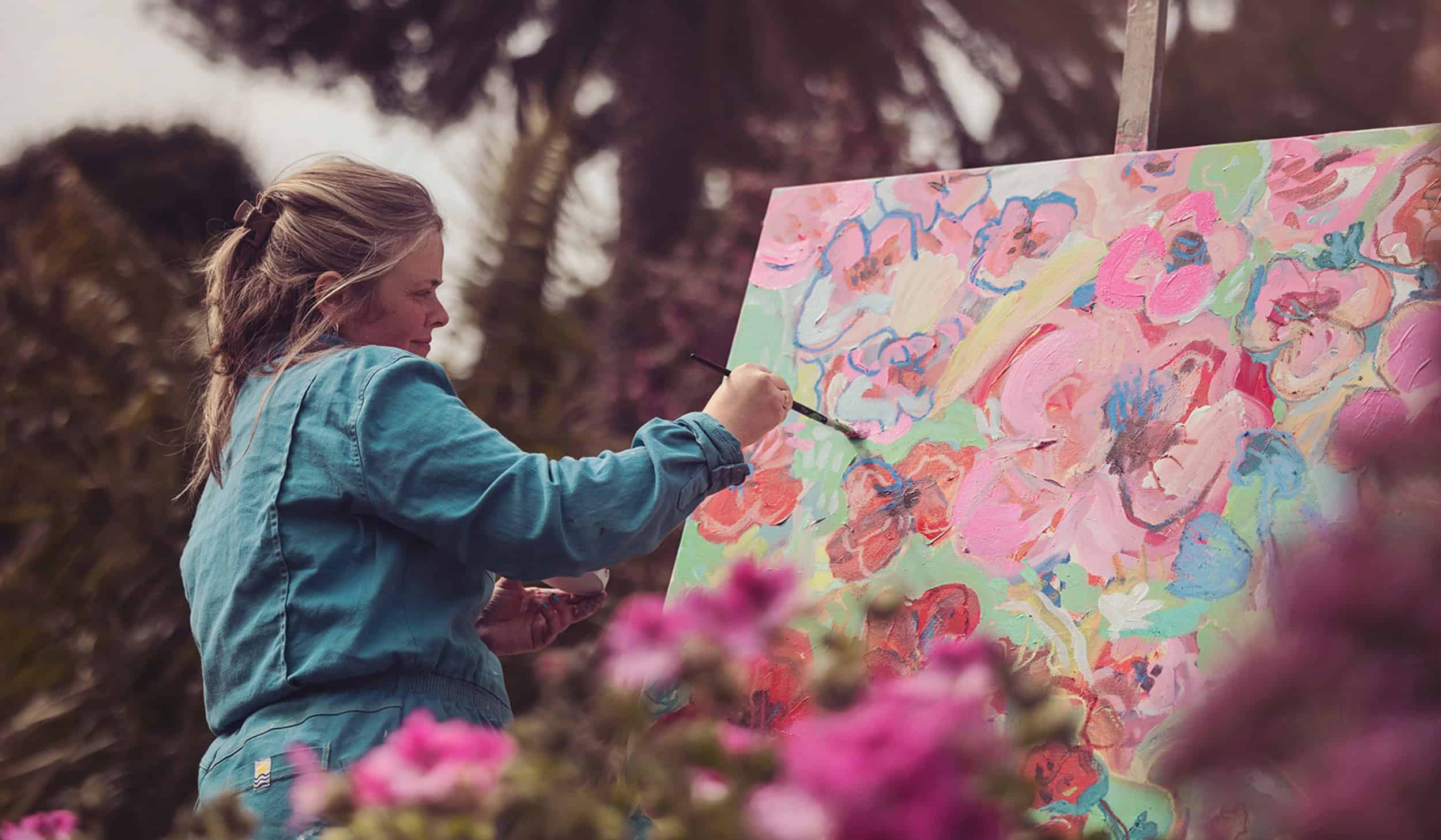 Artist Emily Powell, painting in Tresco Abbey Gardens, Isles of Scilly 
