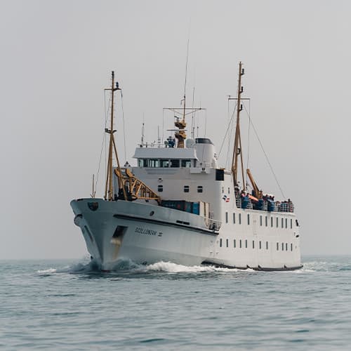 Scillonian III sailing on calm seas towards the Isles of Scilly