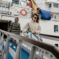 Couple disembarking Scillonian III on to St Mary's quay - Isles of Scilly