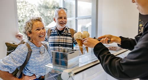 Couple buying troytown ice cream, St Agnes, Isles of Scilly