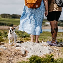 Couple on Gugh, Isles of Scilly with their dog