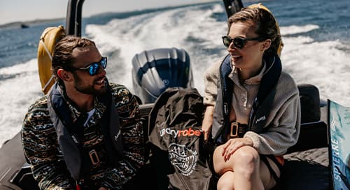 Couple on a rib boat, Isles of Scilly