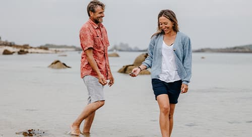 Couple paddling at Pentle Bay, Tresco - Isles of Scilly