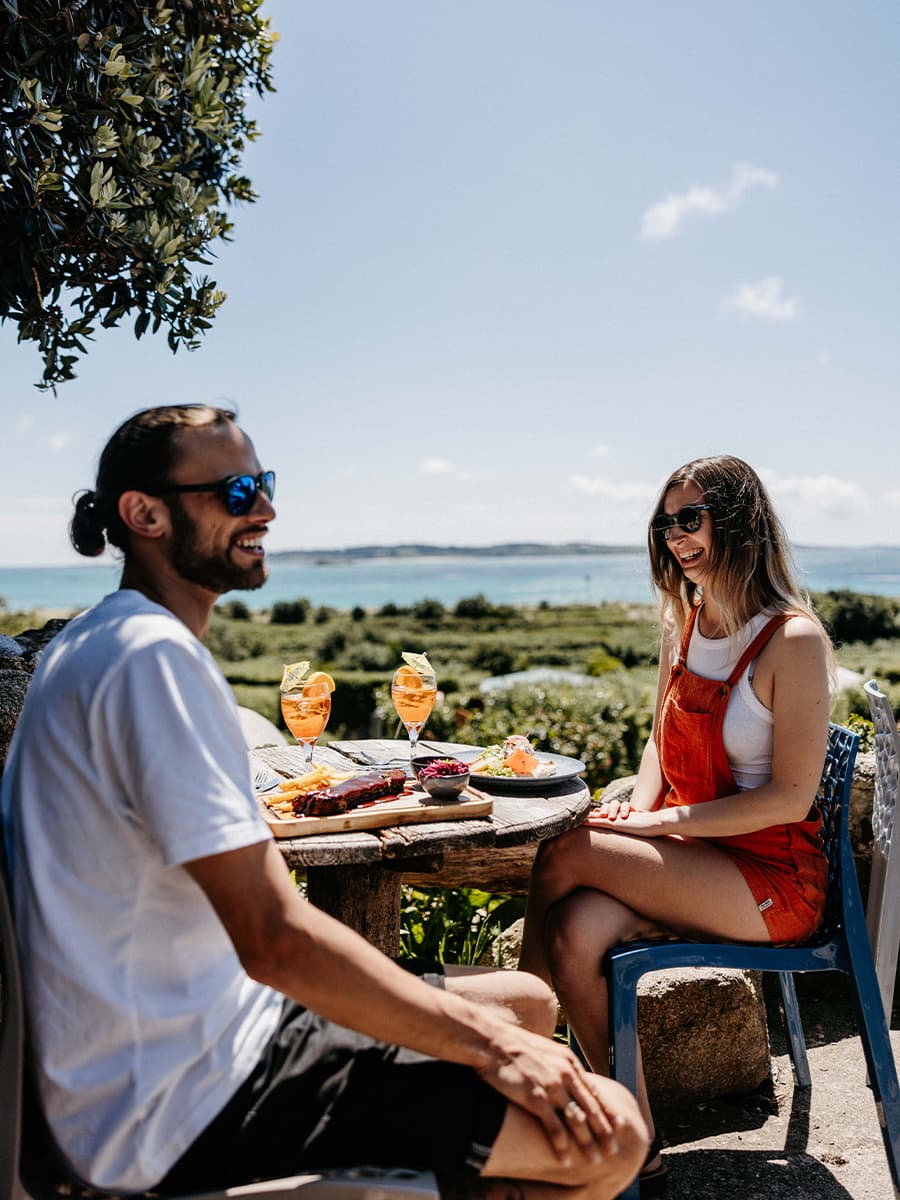 couple having lunch outside, St Martin's, Isles of Scilly