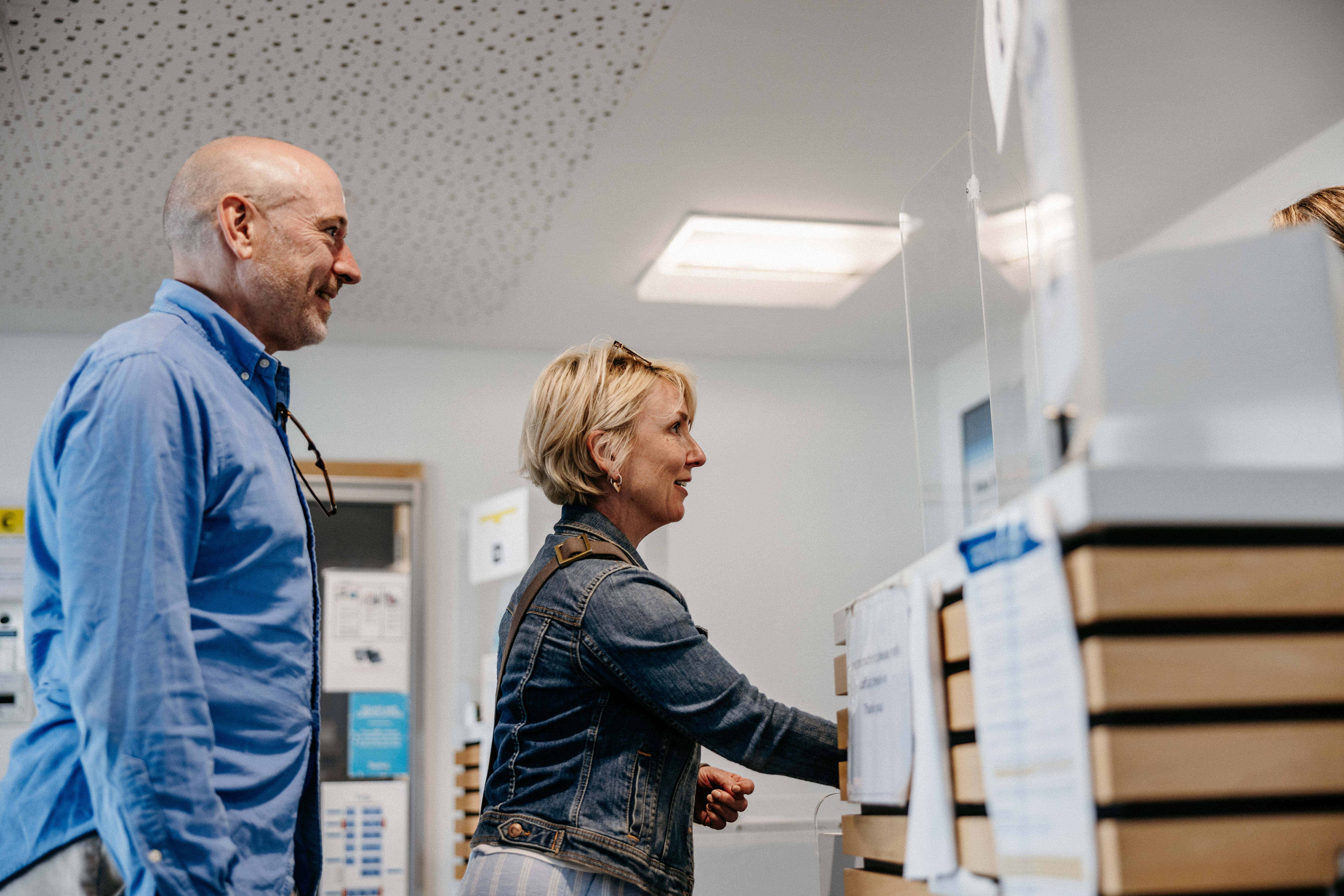 Passengers checking in at Skybus check in desk at airport