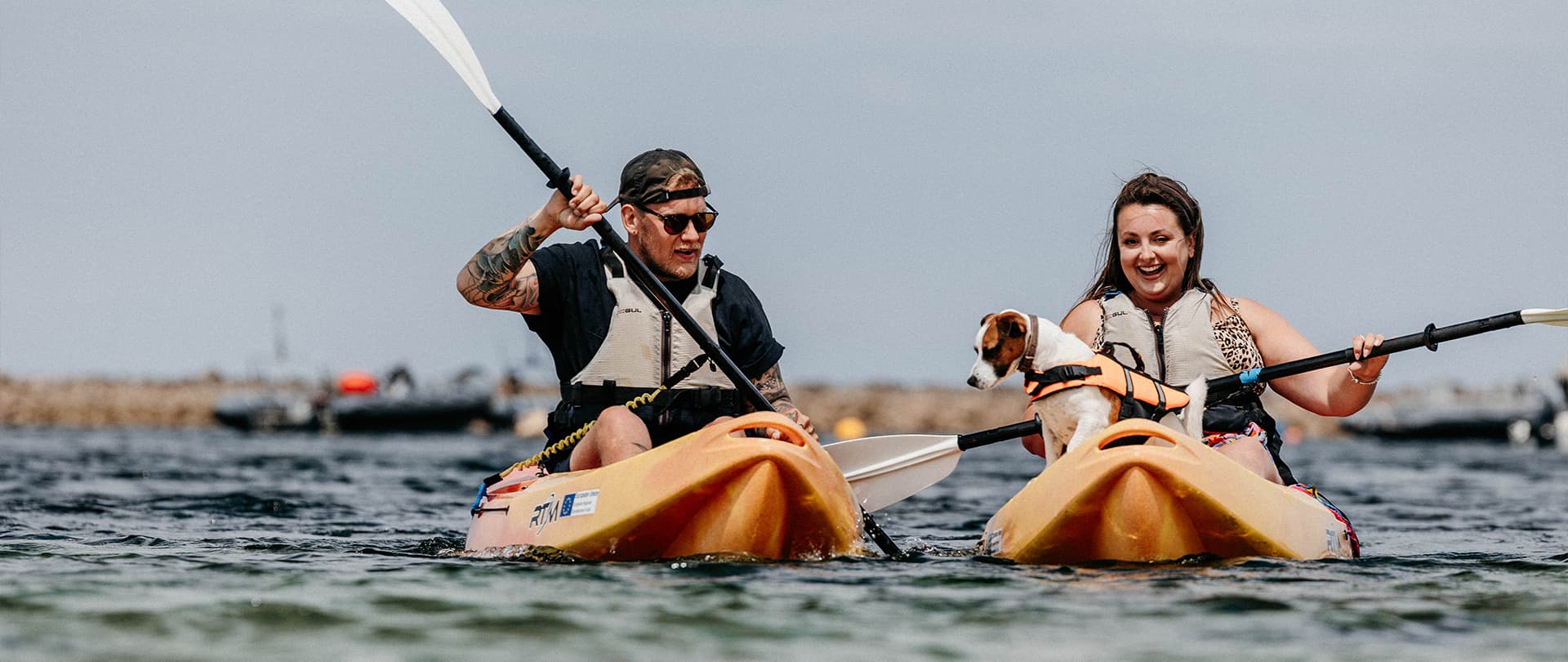 Couple kayaking with their dog, St Agnes, Isles of Scilly