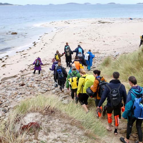 participants walking to next swim point, Scilly Swim Challenge, Isles of Scilly