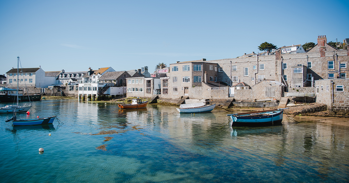 Boats in St Mary's Harbour backing on to buildings in Hugh Town, Isles of Scilly