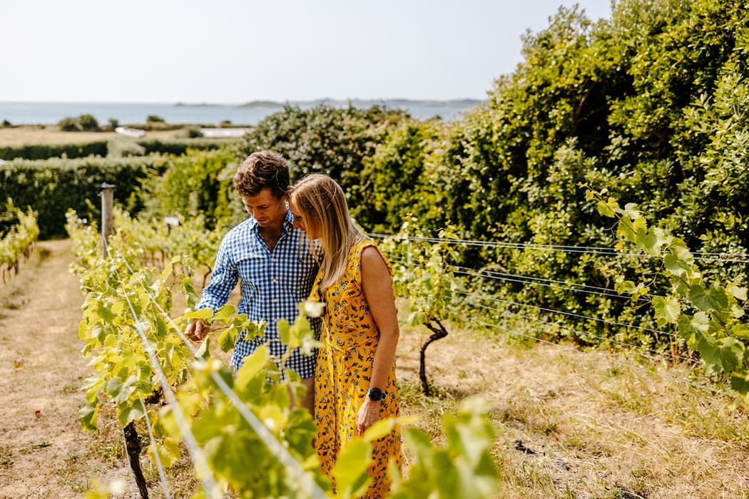 Couple walking around St Martin's Vineyard, Isles of Scilly
