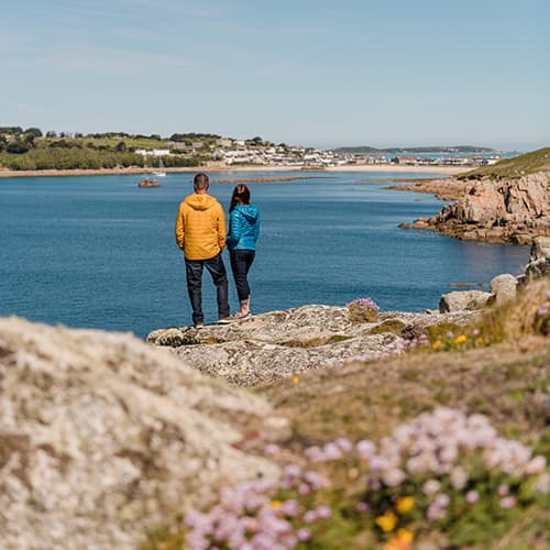 couple walking the coastal path around ST Mary's, Isles of Scilly