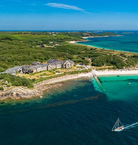 aerial view from a drone showing the coastline and Karma St Martin's Hotel, Isles of Scilly