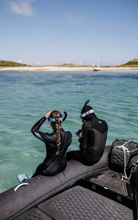 People getting ready to snorkell Par beach, St Martin's, Isles of Scilly