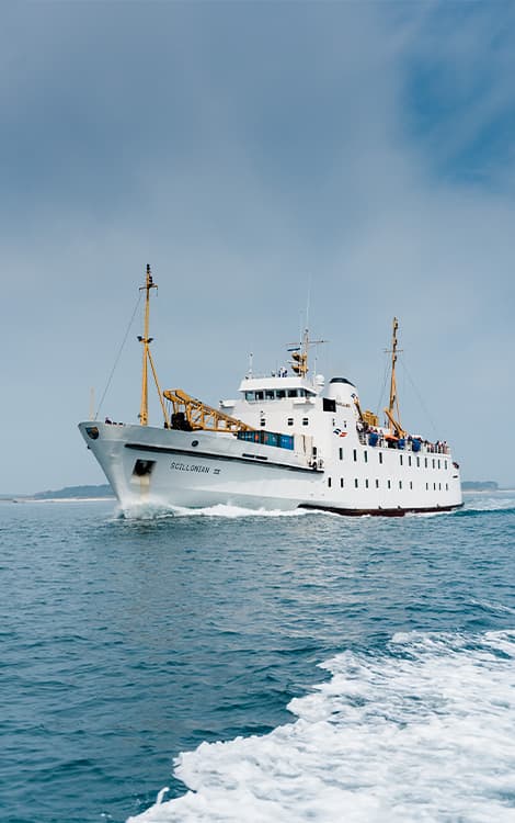 Scillonian III sailing on calm seas towards the Isles of Scilly
