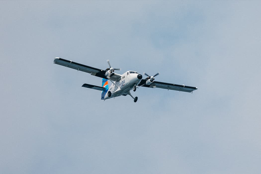 Skybus twin otter flying in the sky