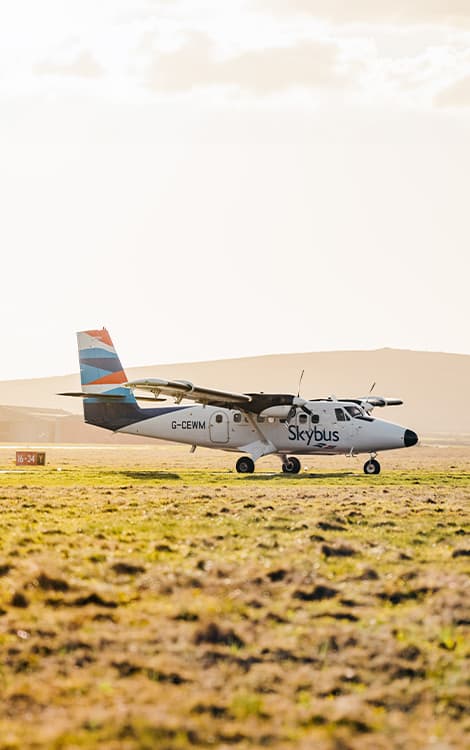 Skybus Twin Otter aircraft on the airfield at Land's End Airport, Cornwall in the morning sun