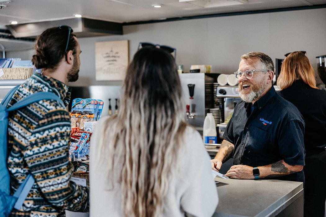 Couple being served on Scillonian III's onboard cafe