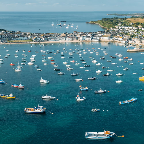 aerial view of St Mary's Harbour and Quay, Hugh town and the garrison, Isles of Scilly