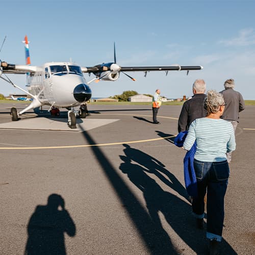 Passengers boarding a Skybus Twin Otter flight from Land's End Airport, Cornwall