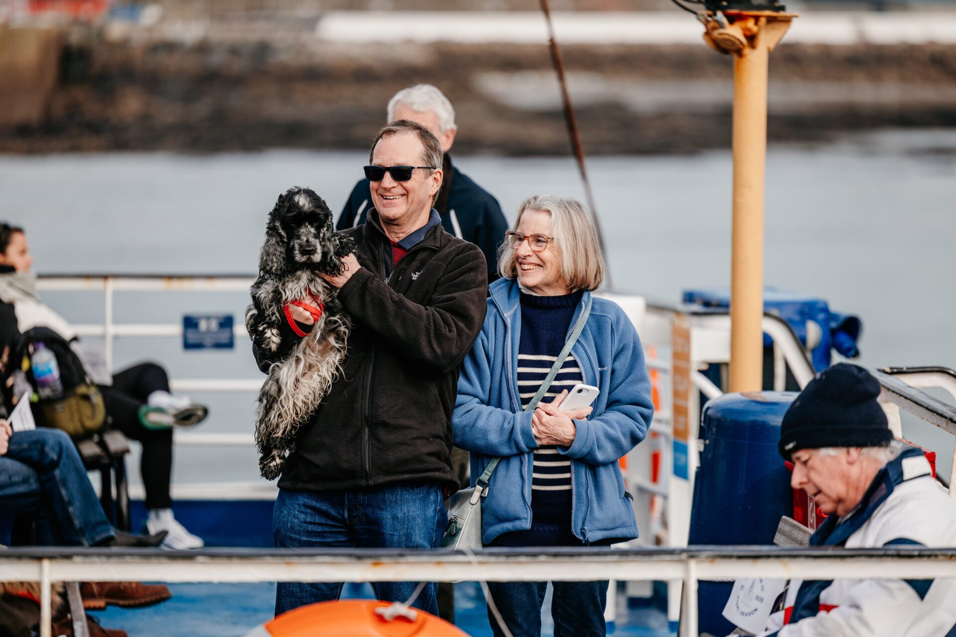 Couple and dog stood onboard Scillonian III on the first sailing of the season.