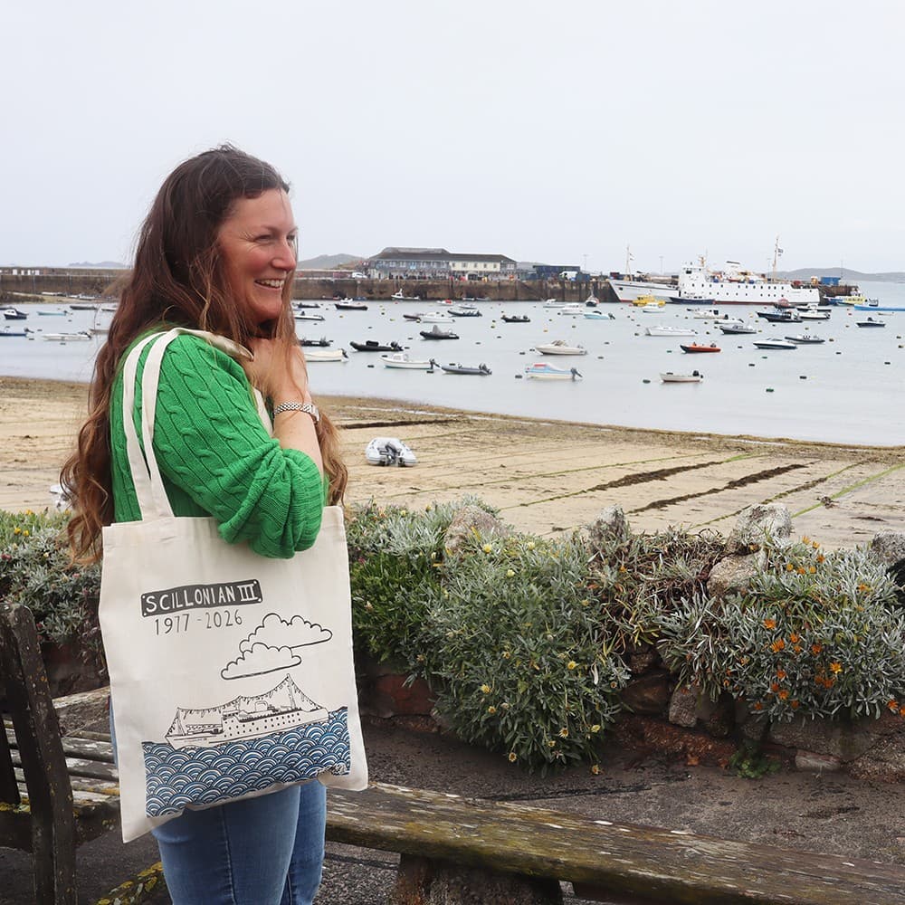 Scillonian III tote bag on ladies shoulder with Scillonian in the background