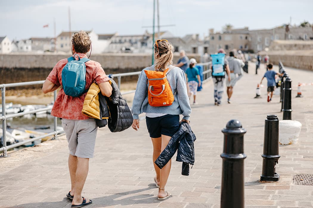 couple walking along St Mary's Quay