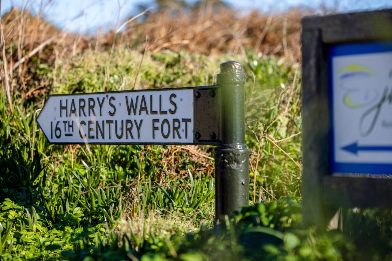 Sign pointing towards Harry's Walls, a historic site on St Mary's