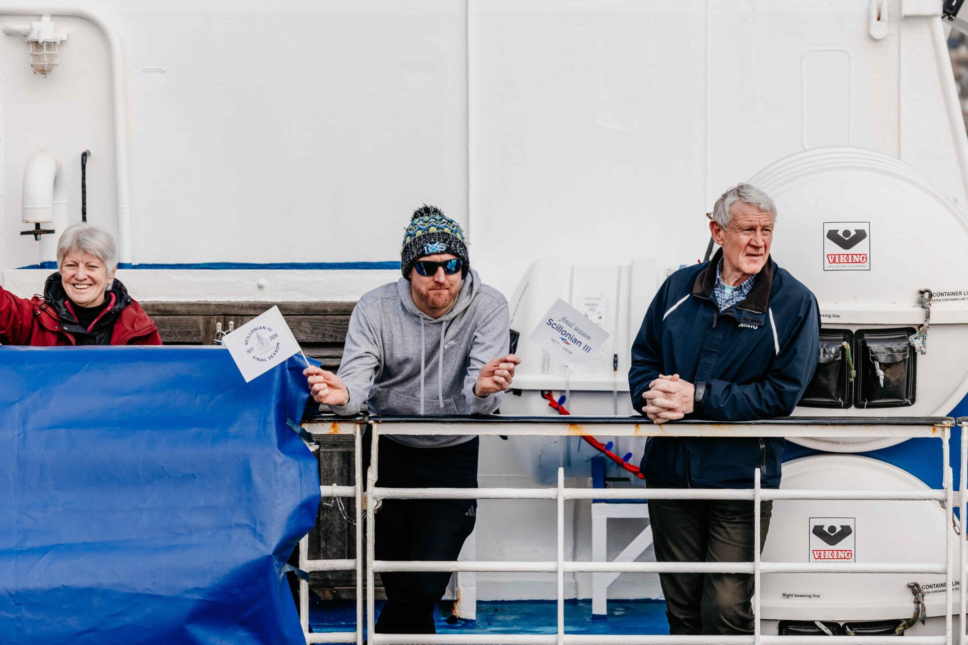 Passenger waving flag on the deck of Scillonian III