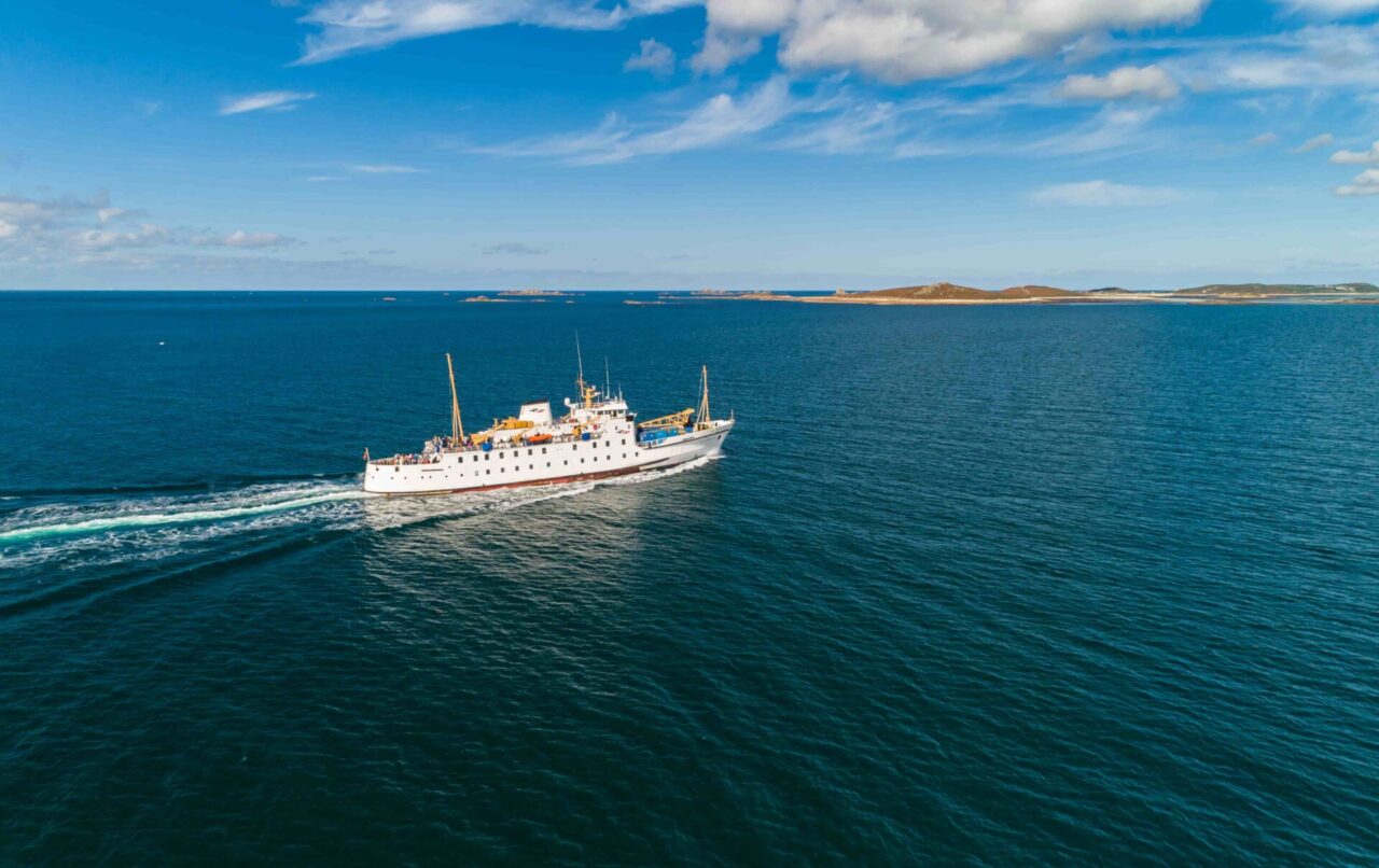 Scillonian III sailing by islands